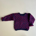 Vamset uldstrik i lilla nuancer 92/98