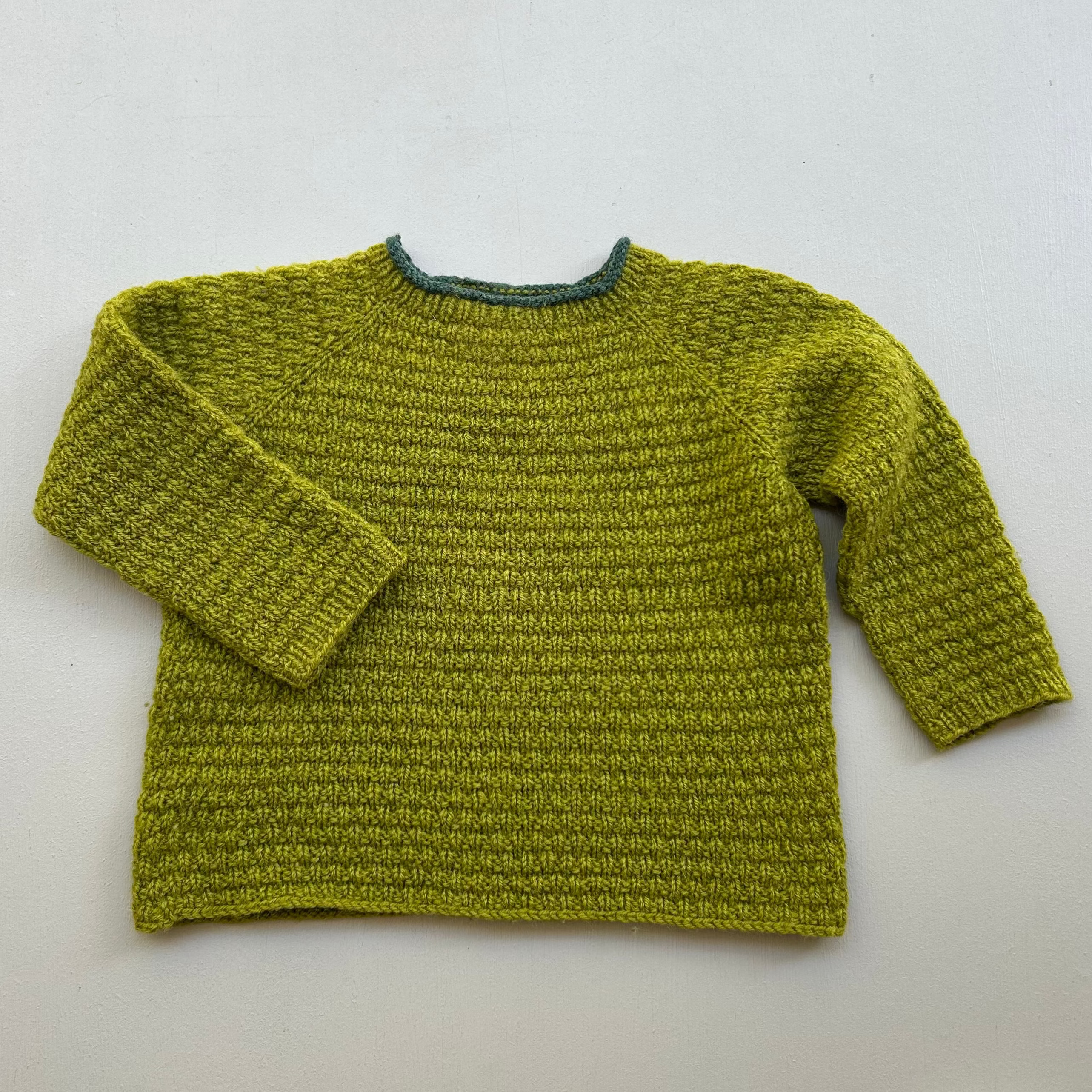 Uldstrik i smuk grøn 92/98
